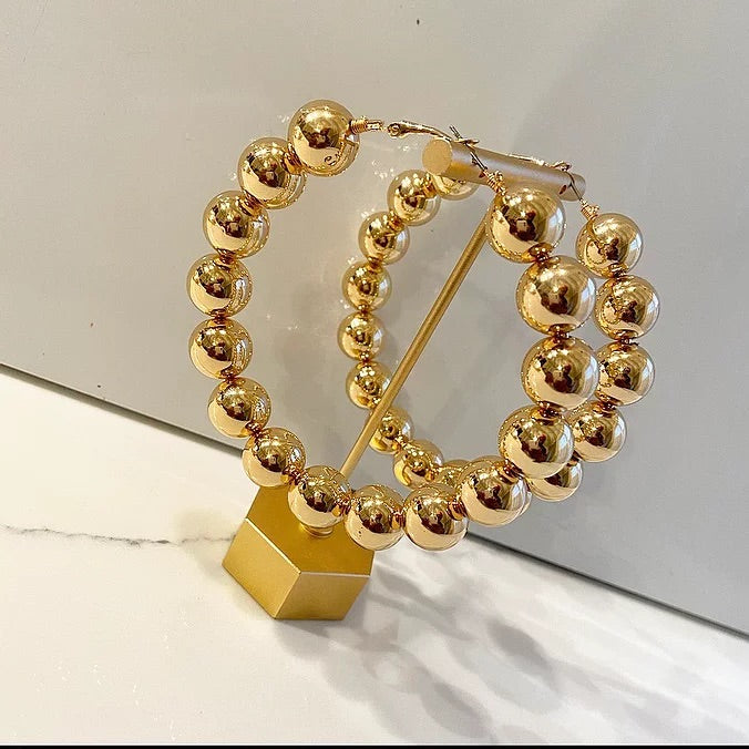 Oversized gold ball hoops